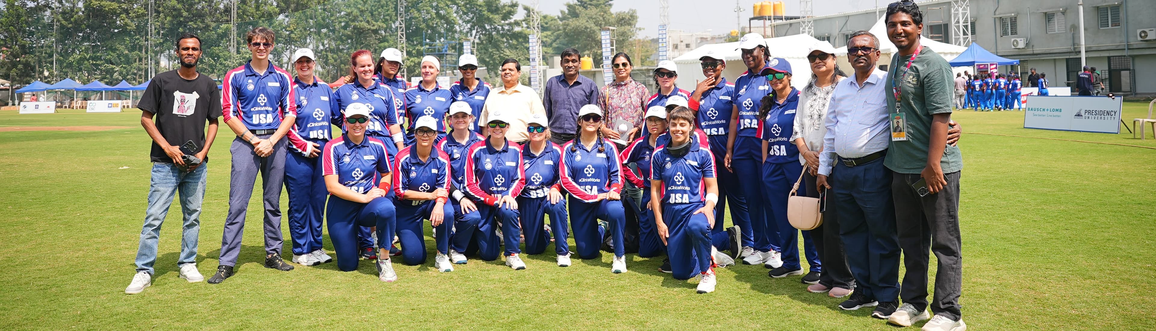 A group of people with disabilities smiling and looking at the camera.