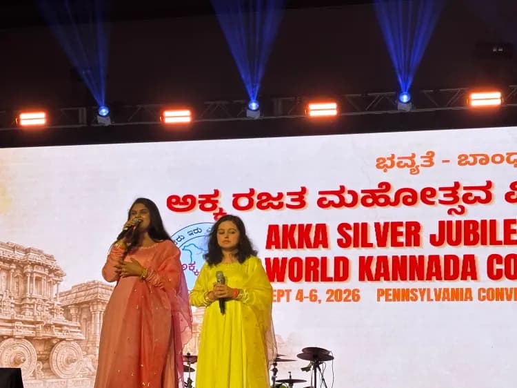 Anusha singing while Vasundhara standing beside her